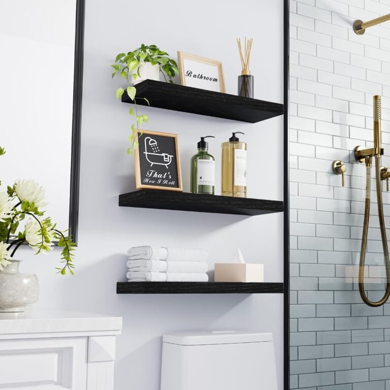 black floating shelves mounted in bathroom with plant and towels