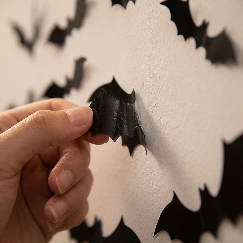 Bat Wall Decor Review: 5 Honest Truths From Verified Buyers 2 close-up of bat wall decor adhesive backing being peeled from wall