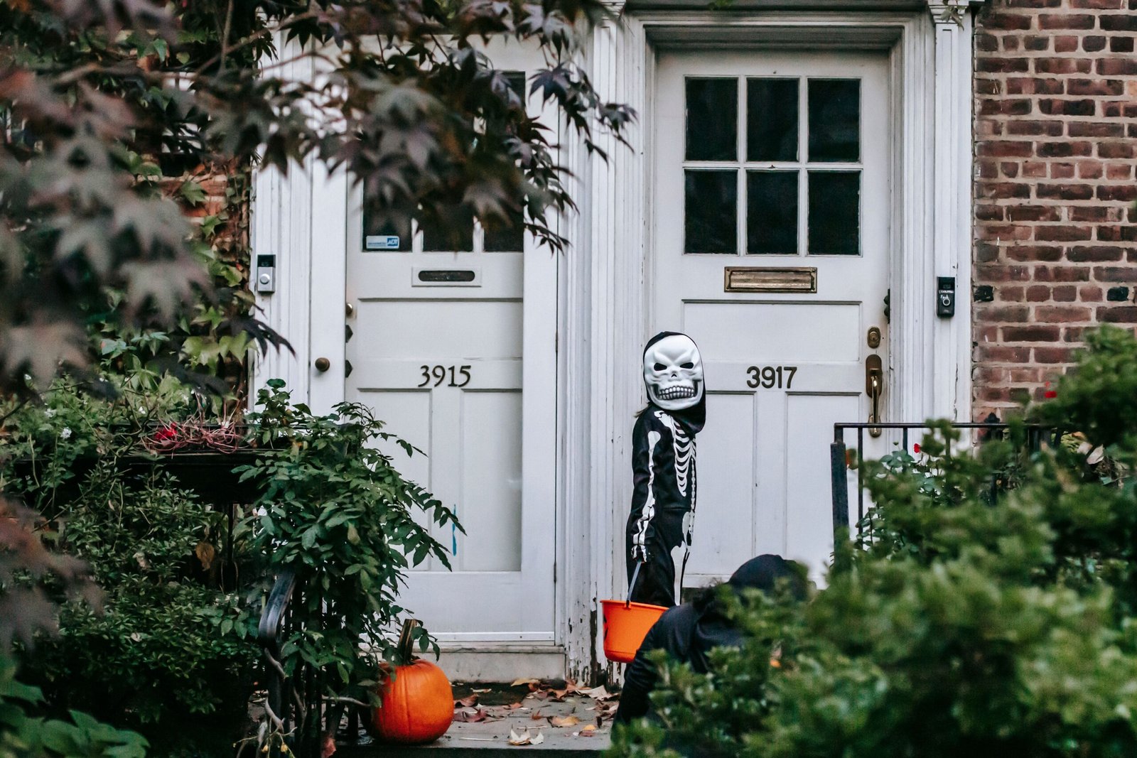 trick-or-treater in skeleton costume during halloween spending season