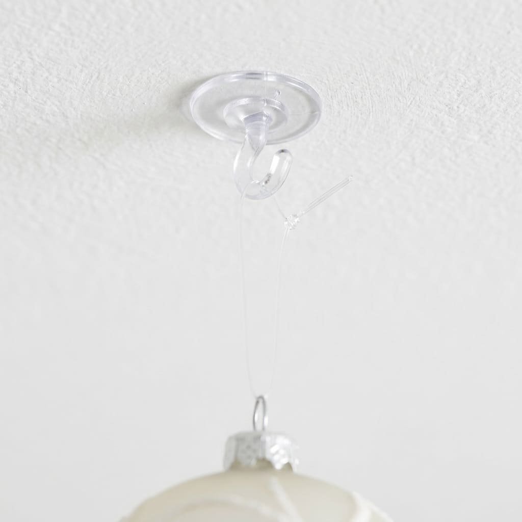 Hanging Halloween Ceiling Decorations: 5 Essential CPSC Rules for Safe Overhead Styling 3 Close-up detail of a damage-free adhesive ceiling hook anchoring transparent monofilament cord for hanging Halloween ceiling decorations