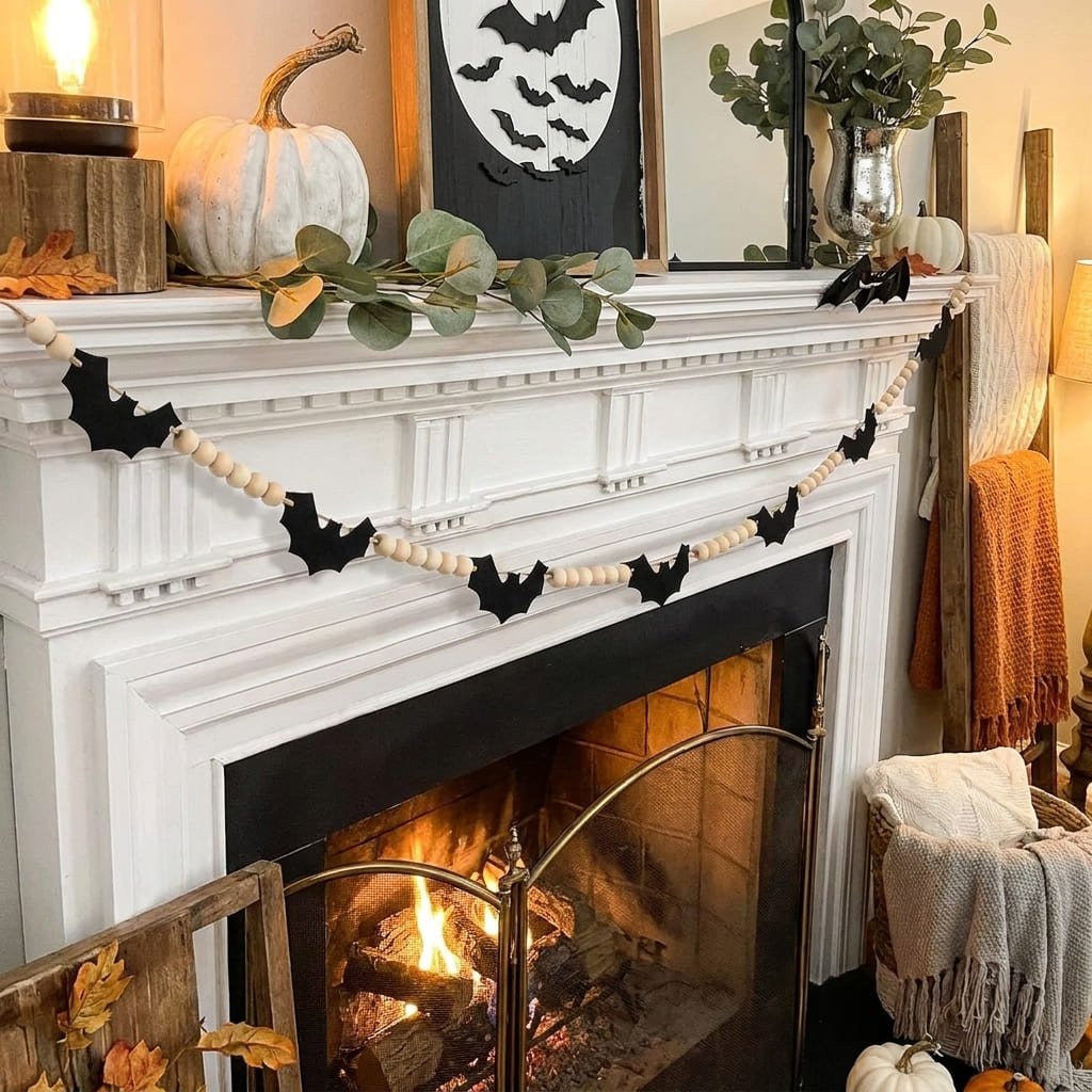 felt bat garland draped in a natural swag along a mantel