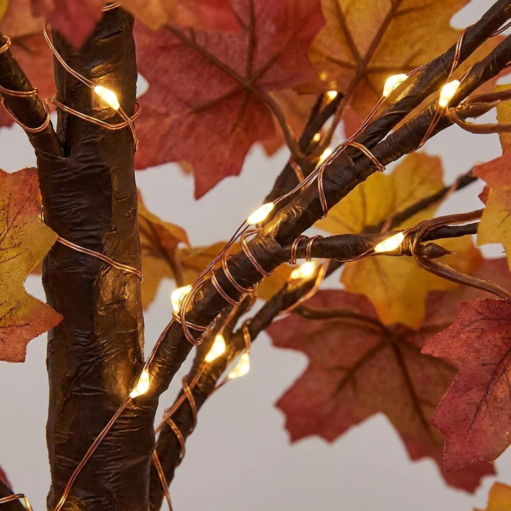 LED Halloween Wreath Safety: 5 Essential CPSC Rules for Front Door Displays 3 Glowing illuminated LED Halloween wreath suspended on a dark wood front door above a rustic porch entrance